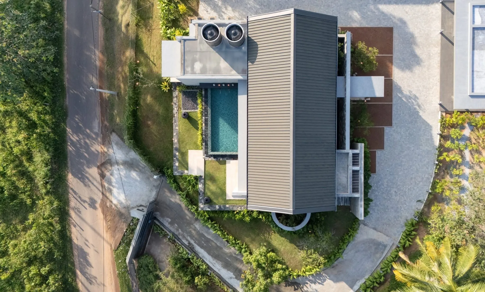 Aerial view of Hansa Villa among palms and paddy fields