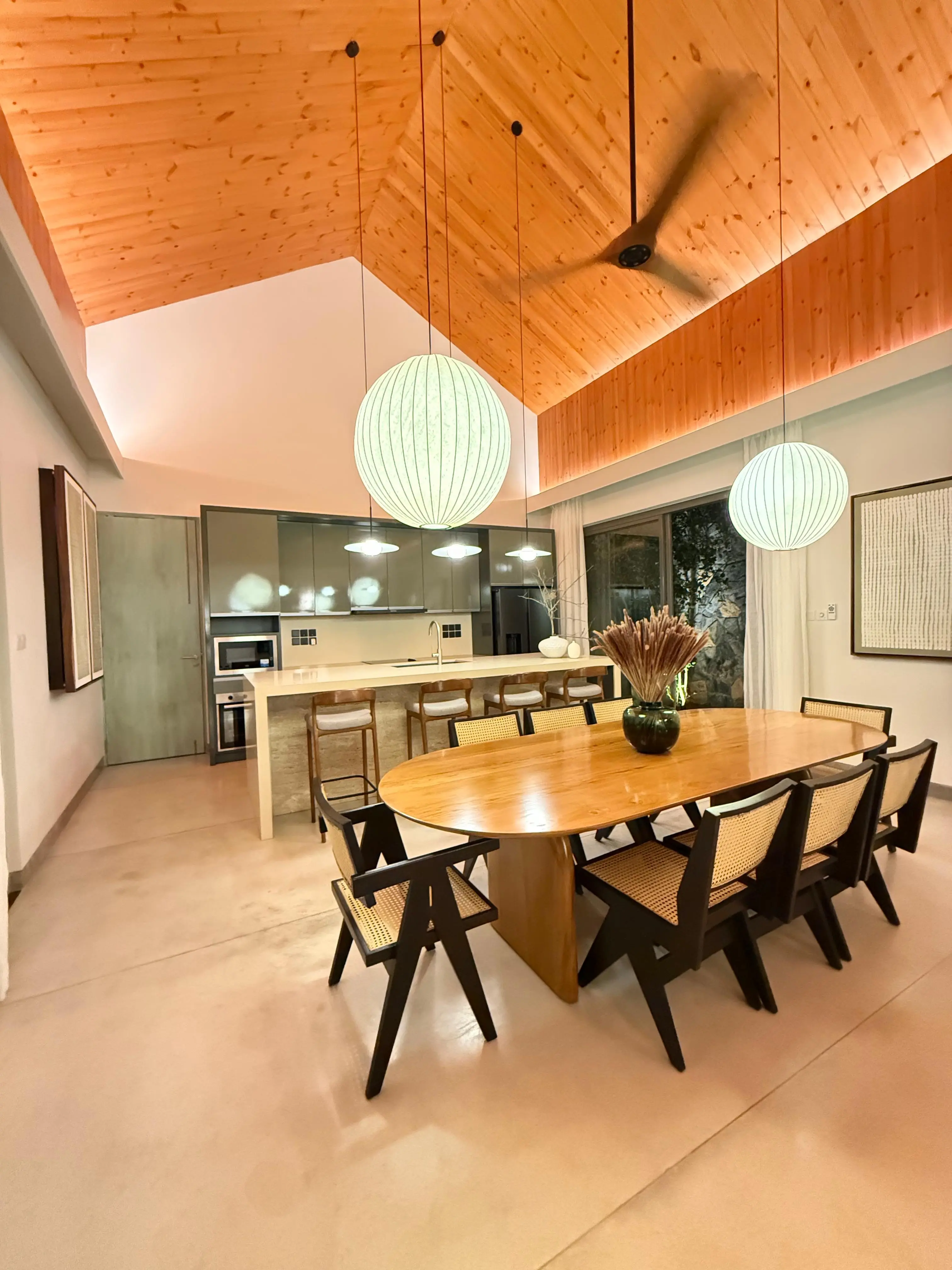 The dining space and kitchen at Hansa Villa in the evening