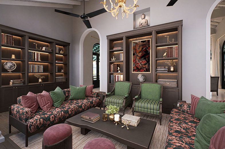 The library at IF Villa with shelves of books and reading chairs