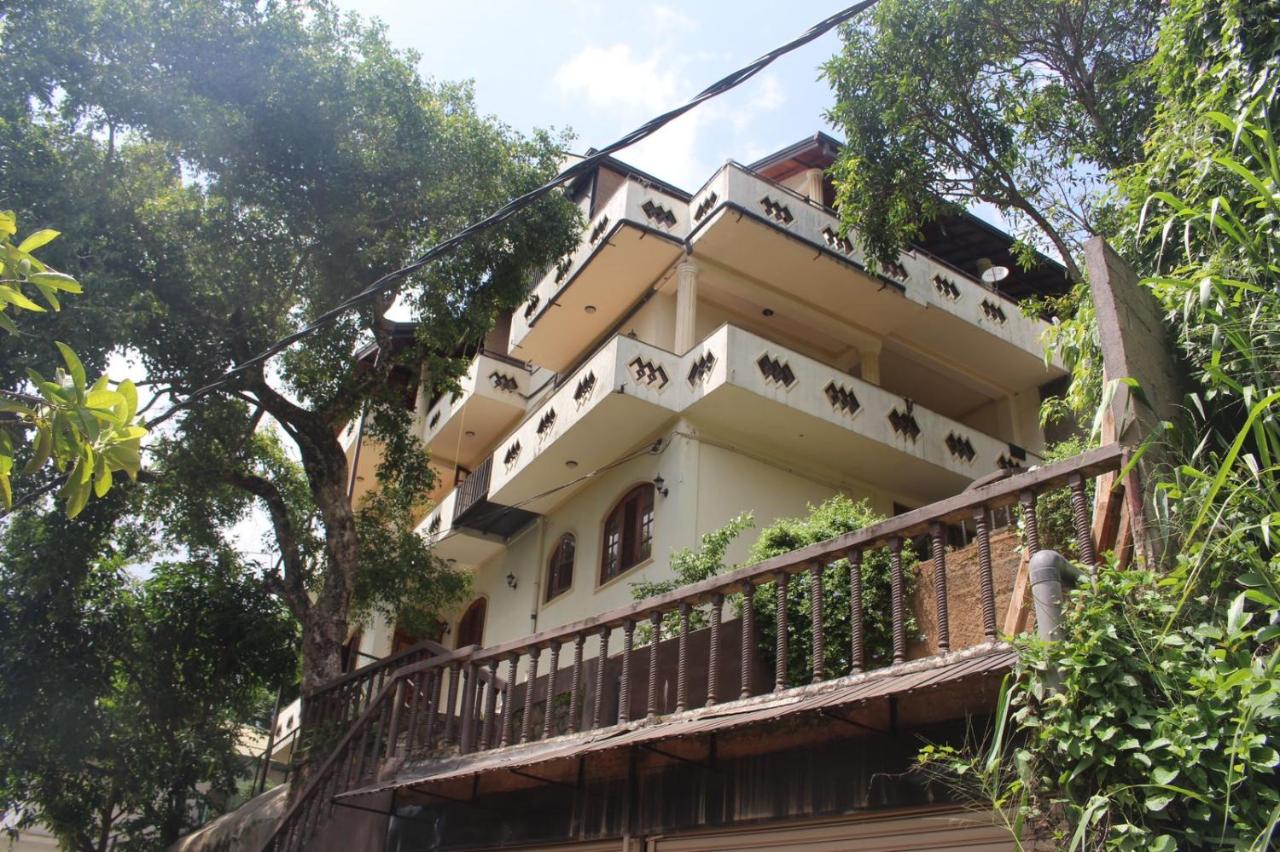 Kandy Villa 119 — a multi-storey villa with balconies set among the trees