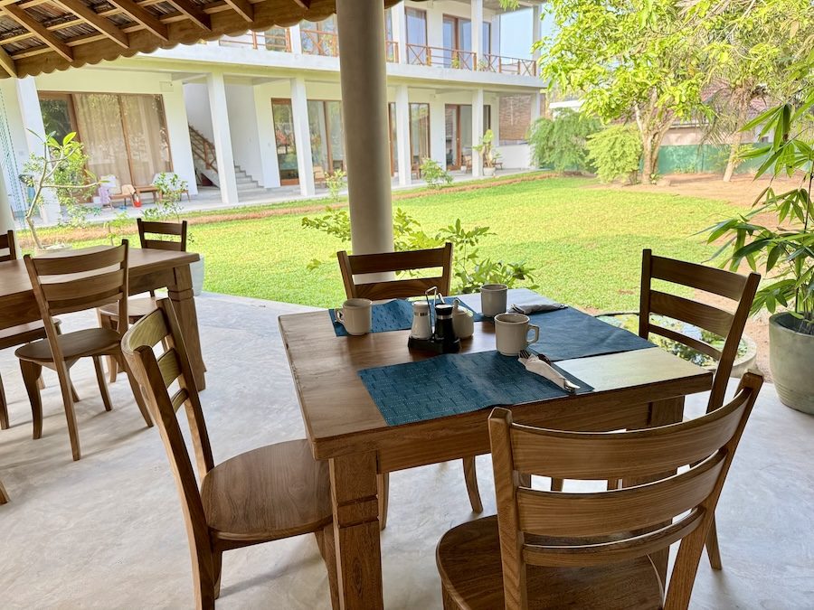 Breakfast tables set in the open-air garden pavilion at Lily Mirissa