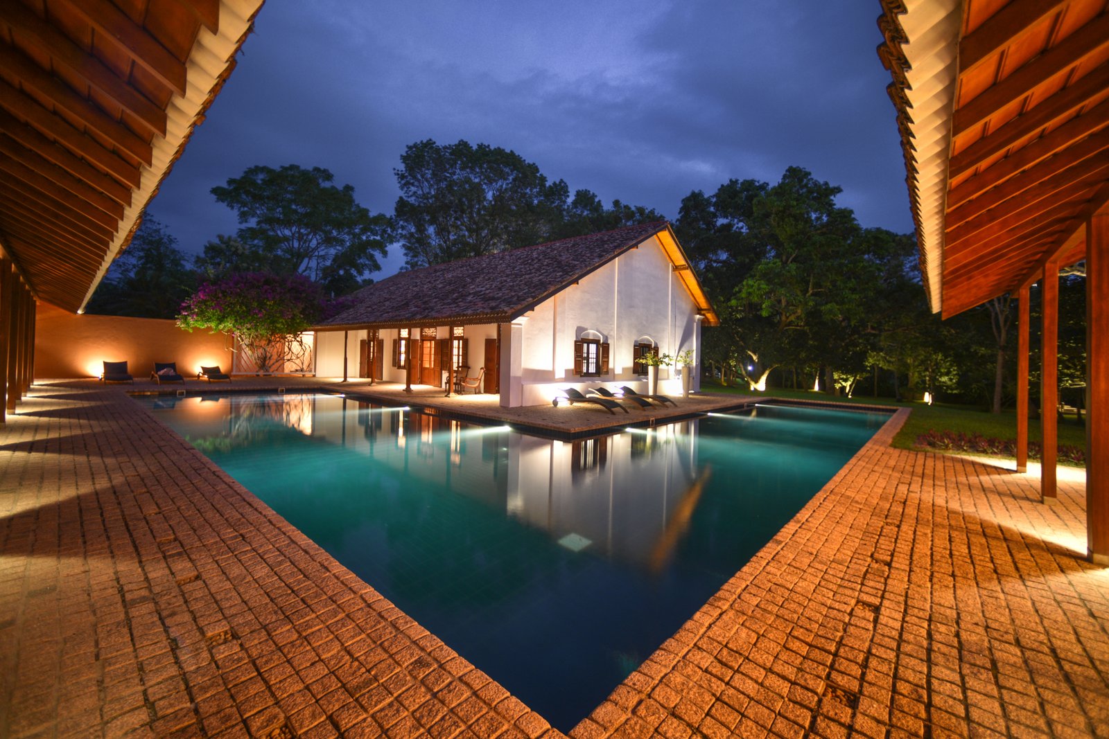 The 20-metre L-shaped pool at Maya Tangalle at dusk