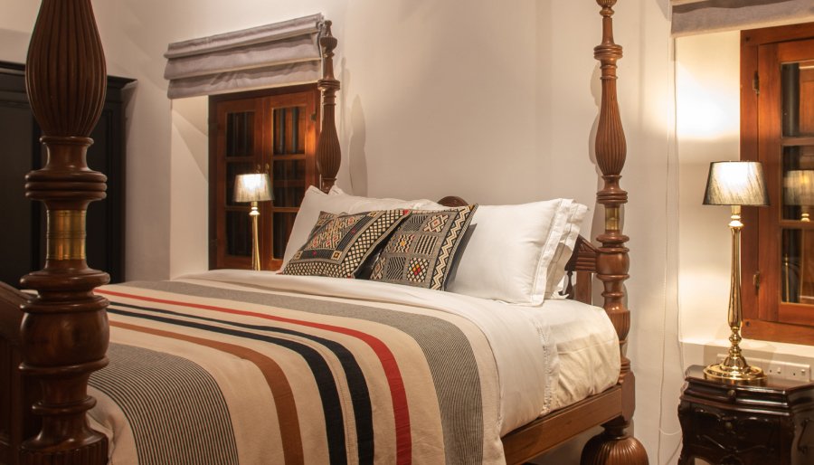 The Presidential Suite at Maya Tangalle with a four-poster ebony bed