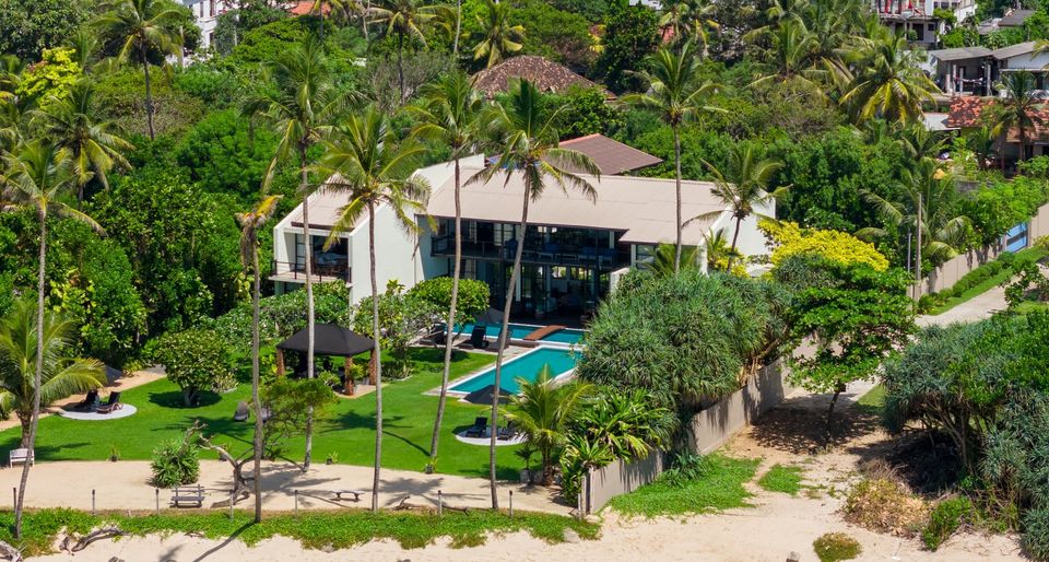 Aerial view of Mirissa Beach Villa and its gardens running down to the beach