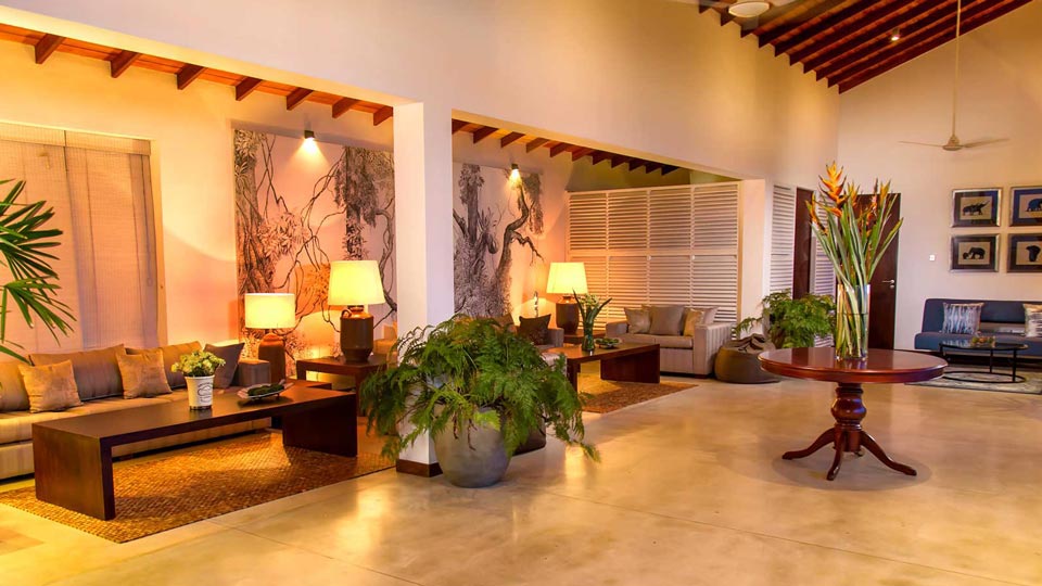 The living room at Mirissa Beach Villa in warm evening light