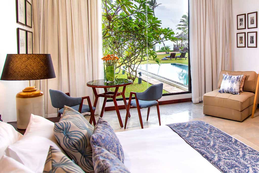 A room at Mirissa Beach Villa with the pool framed in the window