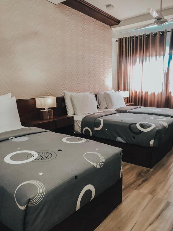 Quadruple room with two beds at Pinnacle Boutique Villas