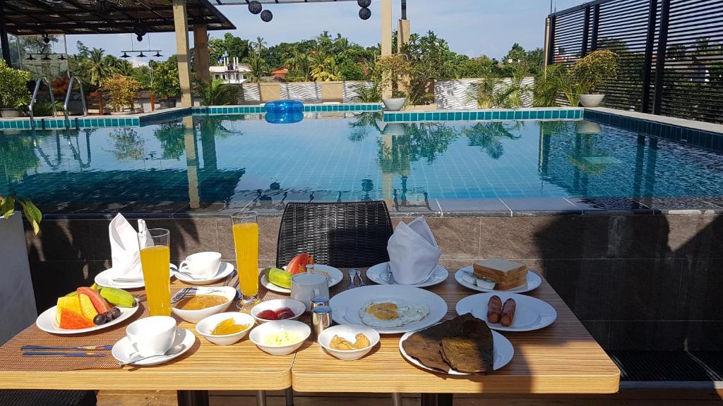 Breakfast table set beside the pool