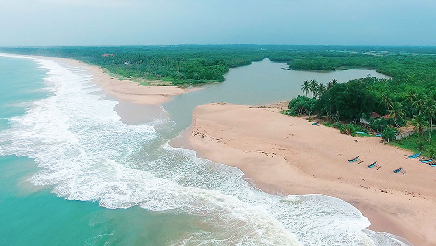 Aerial view of Kahandamodara Beach, the lagoon and palm groves