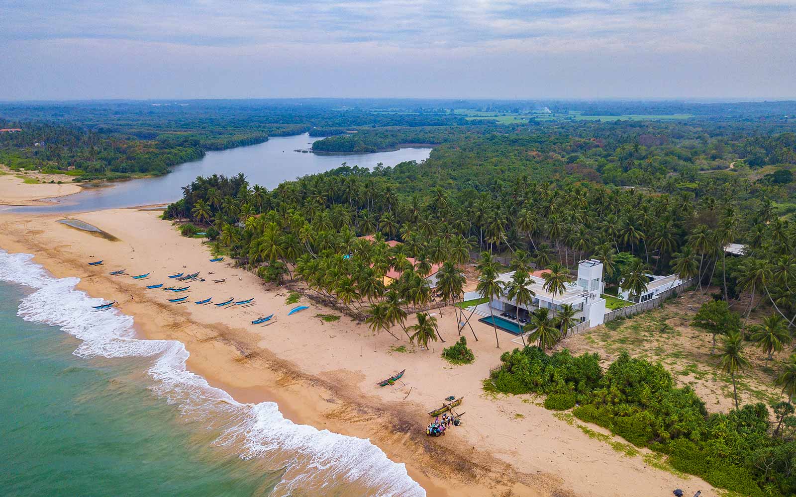 Aerial view of the Kahandamodara coastline, lagoon and palm groves
