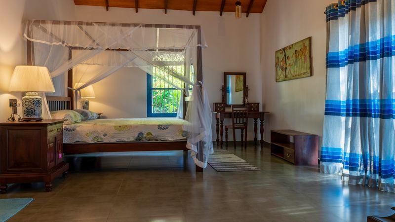 Double bedroom with four-poster bed and garden light