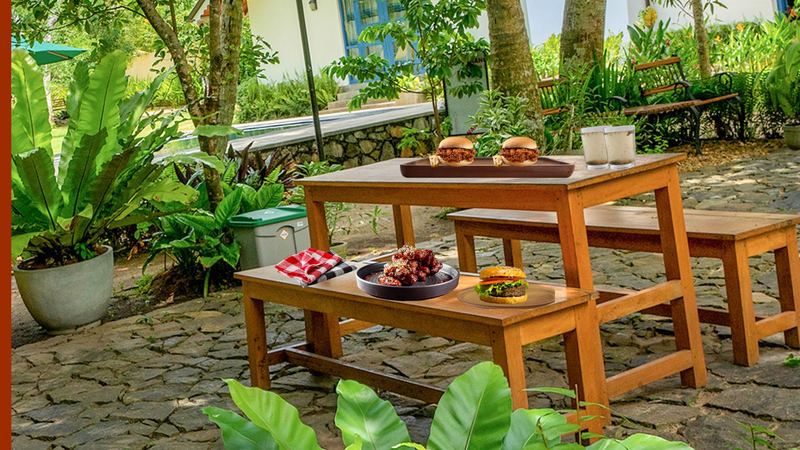 Outdoor dining table beside the pool