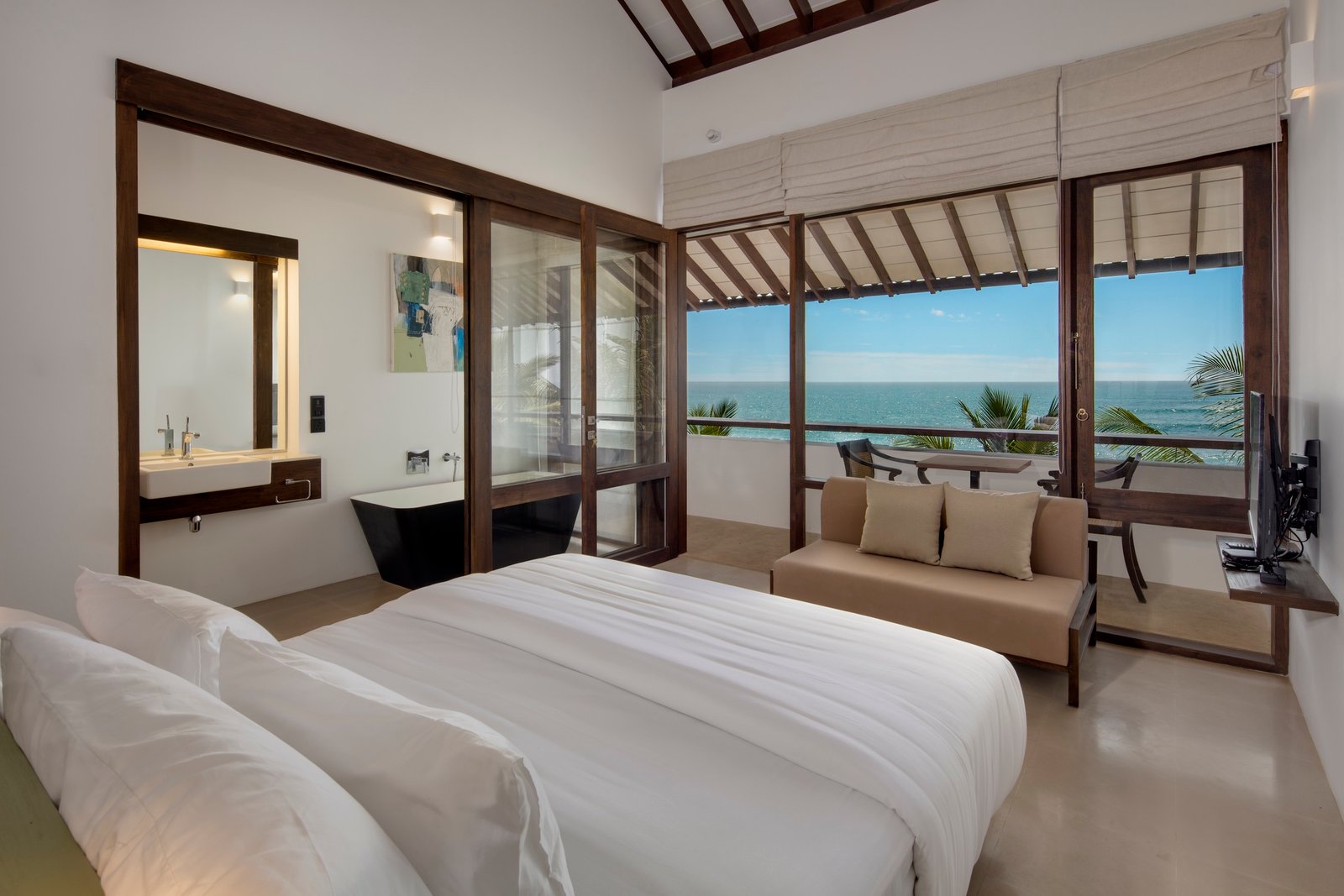 Premier King Room at Three Gables Boutique Villa with a freestanding bathtub and a balcony over the ocean