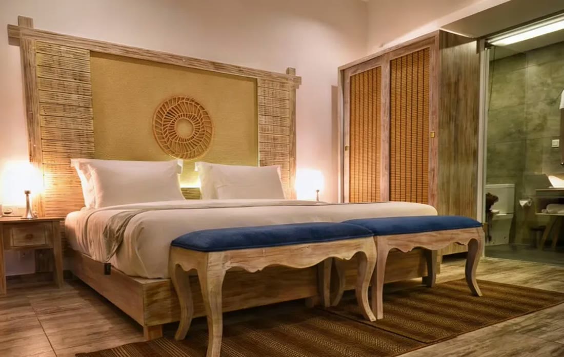 Deluxe Room with Terrace and Pool View at Triple O Six in warm evening light
