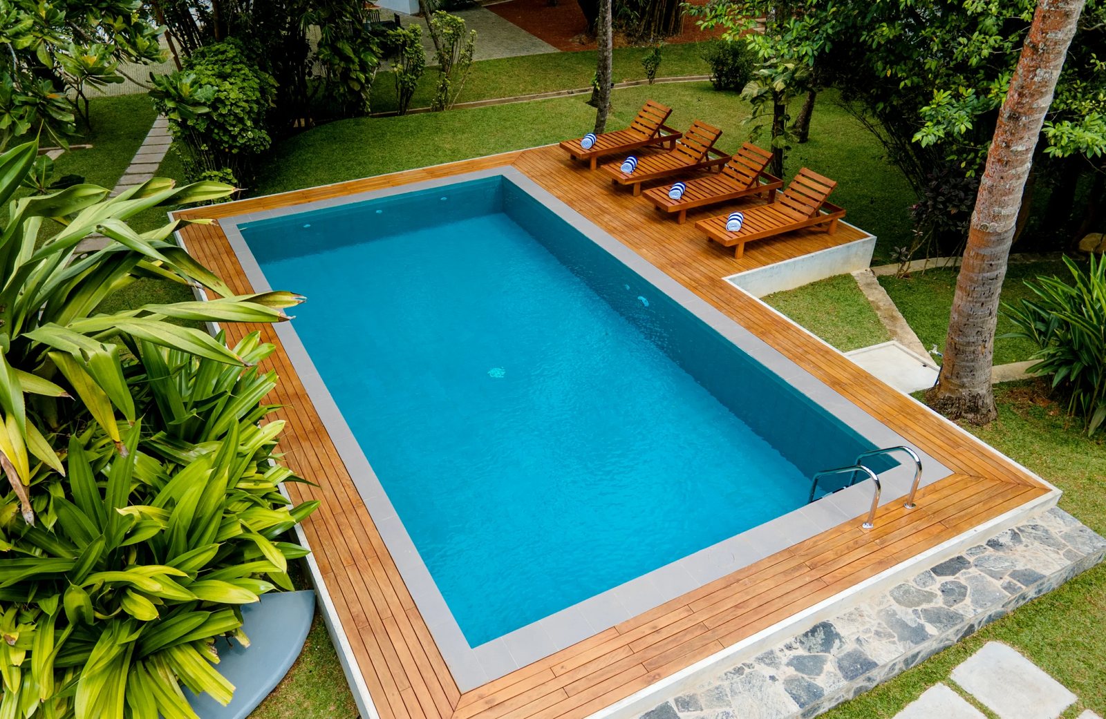 Aerial view of the pool, garden and palms
